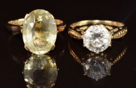A 9ct gold ring set with an oval cut citrine (3.3g, size M) and a 14ct gold ring set with cubic