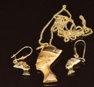 An 18ct gold Egyptian pendant on 18ct gold chain (44cm) with matching earrings, 5g