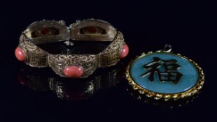 Chinese silver gilt filigree bracelet set with coral cabochons and a silver gilt Chinese pendant set