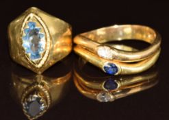 An 18ct gold ring set with an oval cut diamond and sapphire (3.3g, size O) and a yellow metal