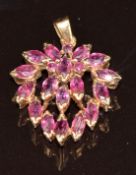 A 9k gold pendant set with marquise cut rubies, 3.1g, 1.6 x 2cm