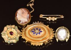 Victorian yellow metal mourning brooch set with a split pearl and enamel, verso a locket
