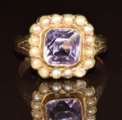 Edwardian ring set with an amethyst surrounded by split pearls, 3.7g, size N (one split pearl