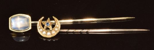 A 9ct gold stick pin set with a moonstone (1.4g) together with an Edwardian 15ct gold stick pin