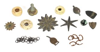 A collection of metal detectorist finds including bronze shield boss decoration, probably Norse,