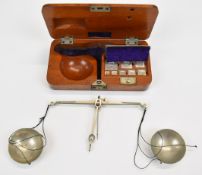 Cased set of late 19th or early 20 century diamond scales with weights from 64 down to one carat,