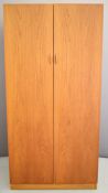 Ladderax teak wardrobe or cupboard with hanging rail and cubby holes, W90 x D60 x H183cm