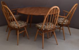Ercol mid century modern light elm drop leaf table and four hoop backed chairs, W126 extended x D110