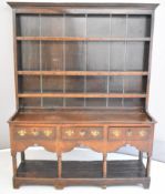 18th / 19thC oak Welsh dresser with three shelves, three straight drawers shaped apron and