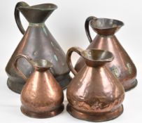 A set of four Georgian / Victorian graduated copper measuring jugs, one with cipher '26', tallest