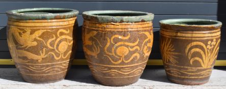Three Chinese jardinières / garden planters with dragon and foliage decoration, largest diameter