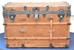 19th / 20thC ash and metal bound travelling trunk with interior label 'Travelers Casualty Co,