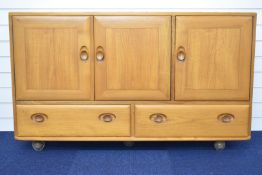 Ercol mid century modern light elm sideboard with three cupboards and two drawers under, W130 x