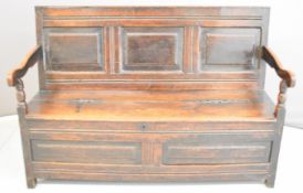 19thC panelled oak settle with peg joints and scrolling arms, W140 x D44 x H94cm