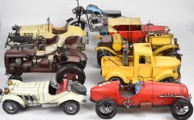 Nine vintage look pressed steel veteran cars and similar, largest 34cm long.