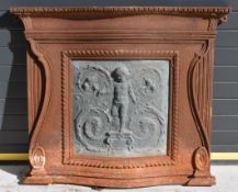 Victorian cast iron serpentine fronted chimney piece with scrolling and wrythen decoration and inset