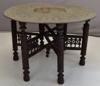 19th / 20thC Indian / Sri Lankan carved low table with brass top and central well, diameter 76 x