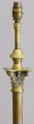 Extendable brass standard lamp with reeded column and stepped base raised on lion pad feet, H120cm