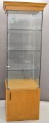 Contemporary glazed oak illuminated display cabinet with cupboard under, W57 x D57 x H202cm