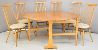 Ercol mid century modern light elm table and six comb backed chairs with cushions, W140 extended x