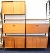 Ladderax mid century modern teak shelving unit comprising three cupboards with sliding doors and two