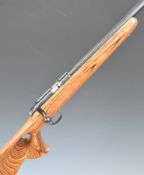 CZ 455 .17HMR bolt action rifle with laminated show wood stock, thumb hole grip, raised cheek piece,