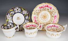 Two New Hall cabinet cups and saucers, one with additional cup, all with floral decoration including