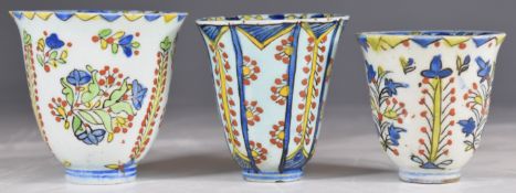 Three 18thC Turkish Kutahya polychrome decorated beakers, tallest 7.5cm
