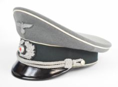 German WW2 Nazi Third Reich Officer's peaked cap with silver wire bullion badge, chin cords and