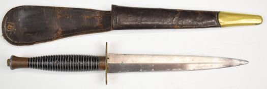 Fairbairn Sykes style fighting knife with ribbed grip, 17.5cm double edged blade and leather sheath.