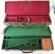 Two leather bound shotgun carry cases, both with fitted interiors, largest 84x23x9cm.