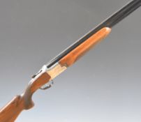 Laurona 12 bore over and under ejector shotgun with engraved shooting scenes to the locks, chequered