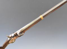 Unnamed 12 bore flintlock muzzle loading gun with brass trigger guard and butt plate, steel ram-rod,