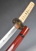 Japanese Samurai sword with bound grip, two menuki, decorated tsuba, 62cm curved blade and scabbard.