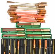 A collection of rifle and pistol cleaning kits and rods comprising ten 2-piece plastic covered steel