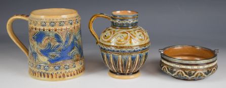 Three Royal Doulton and Doulton Lambeth art pottery items comprising tankard, jug and basket with