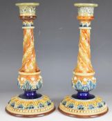 Pair of Doulton Lambeth art pottery candlesticks of wrythen form, H30cm
