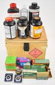 A collection of shotgun or rifle cartridge re-loading materials including six tubs of smokeless