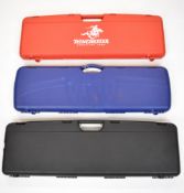 Three shotgun cases comprising Winchester with three chokes and accessories, Beretta and one