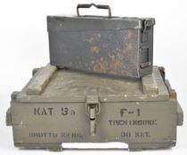 Two military ammunition boxes, one wooden marked 'KAT 5A Brutto 22kg F-1 Treningowe 30 SZT' (49 x 36