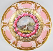 Coalport relief moulded cabinet plate with decoration of eagle owl with prey within rose surround,