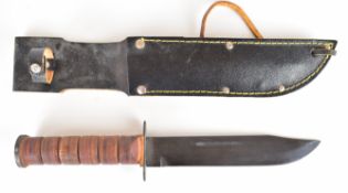 US Marine Corps style combat knife with leather grip, 18cm single edged blade, sheath and leg tie.