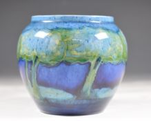Early Moorcroft squat covered vase decorated in the Moonlit Blue Landscape pattern with a continuous
