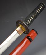 Japanese short sword with signed tang, decorated tsuba, bound grip, two menuki, decorated habaki,