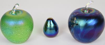 Three John Ditchfield for Glasform iridescent glass paperweights, two in the form of apples, all