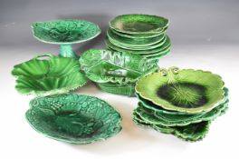 Eighteen 19th / 20thC majolica green leaf plates and dishes including Copeland, Wedgwood, Ralph