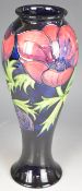 Moorcroft pedestal vase decorated in the Anemone pattern, signed with monogram to base, H27cm