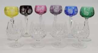 Ten cut glass drinking glasses comprising six flash overlaid hock glasses and four Waterford Crystal