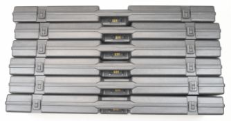 Six ABS shotgun hard carry cases with combination locks.