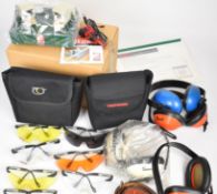 A collection of shooting related accessories including a Dry Fire clay pigeon target shooting